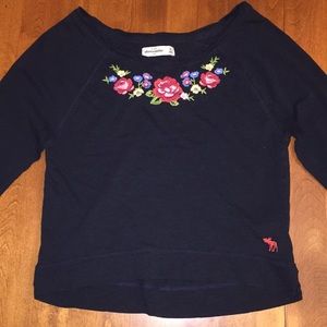 Black Abercrombie shirt with flowers.